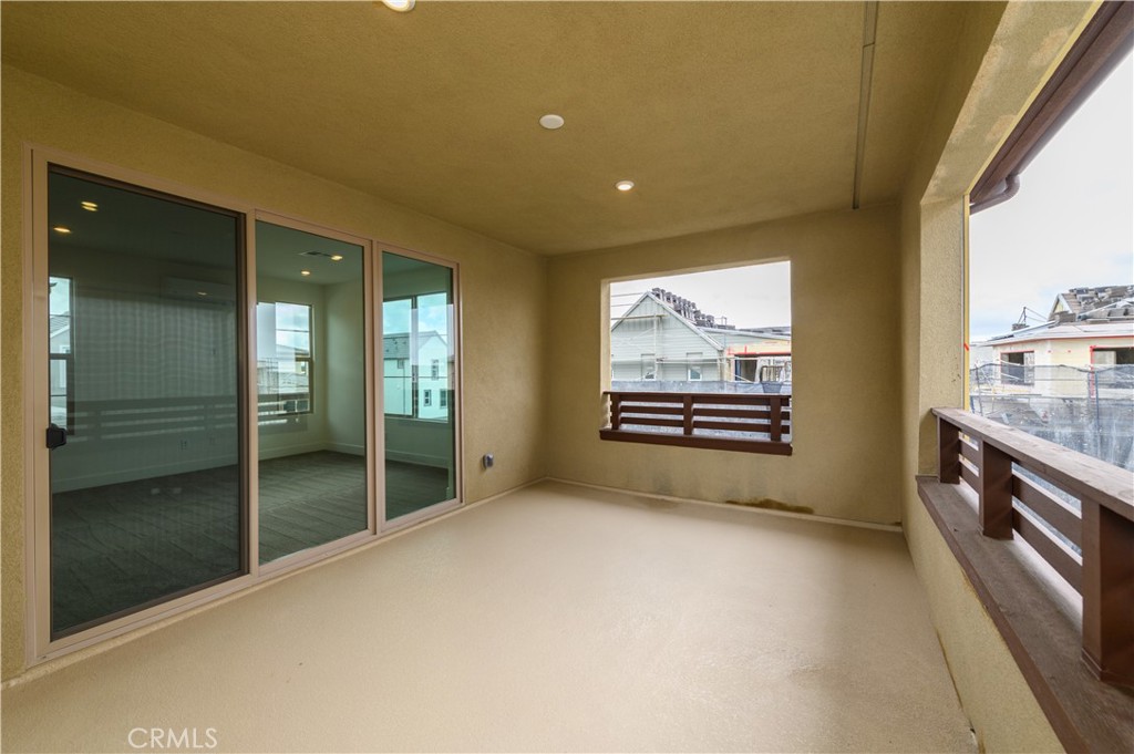 194 Abacus Irvine, CA 92618 - Photo 31 of 34 a view of an empty room with glass door and a window