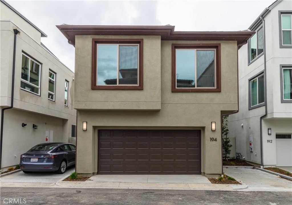 194 Abacus Irvine, CA 92618 - Photo 33 of 34 a front view of a house with parking