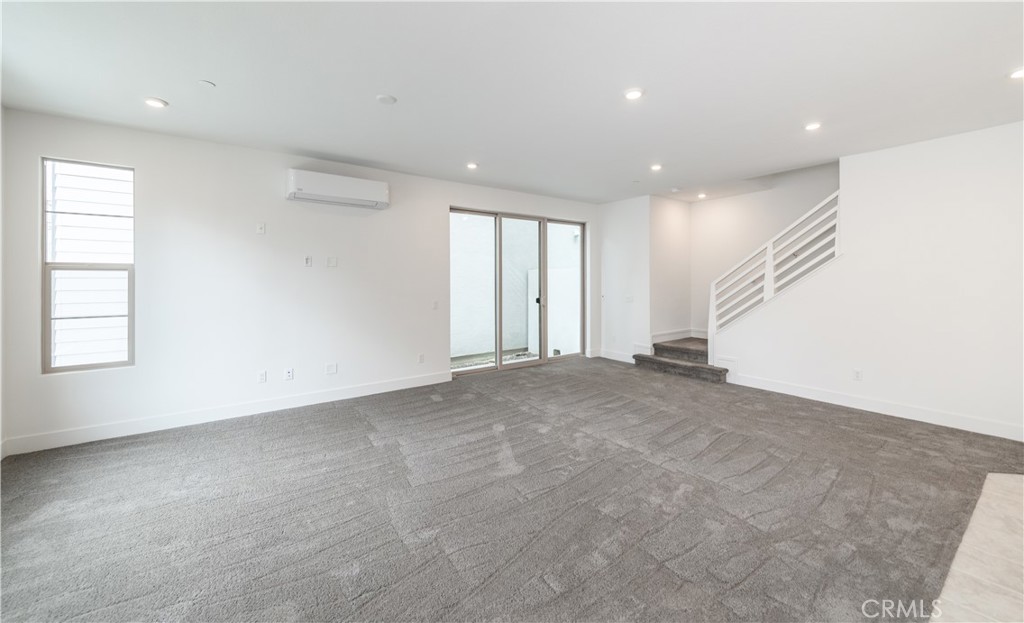 194 Abacus Irvine, CA 92618 - Photo 7 of 34 an empty room with windows and pillars in it