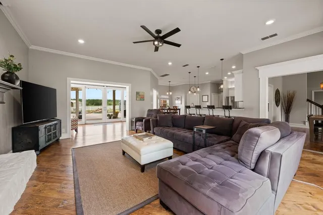a living room with furniture fireplace and a chandelier
