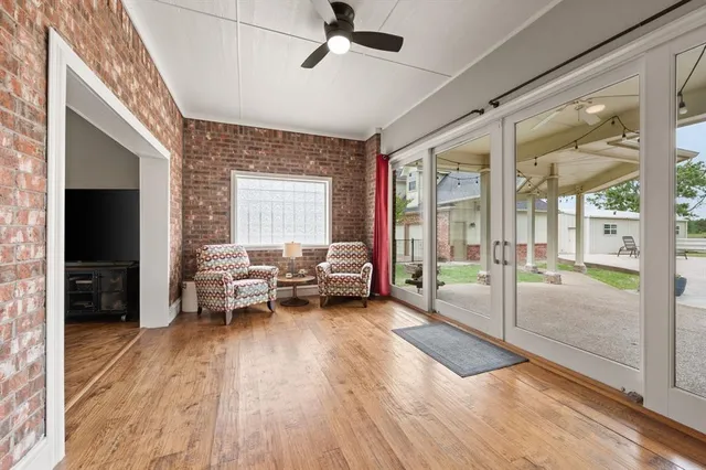 a kitchen with stainless steel appliances kitchen island granite countertop a sink and cabinets