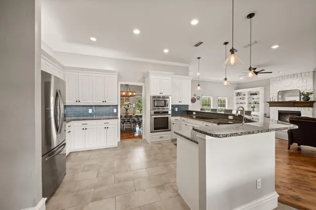 a large kitchen with cabinets