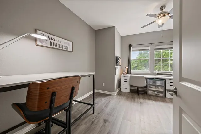 a large kitchen with stainless steel appliances a stove and a window
