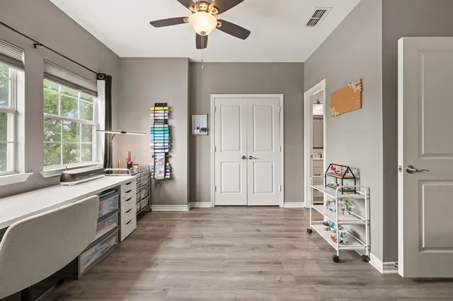a en suite bathroom with a double vanity sink and a mirror