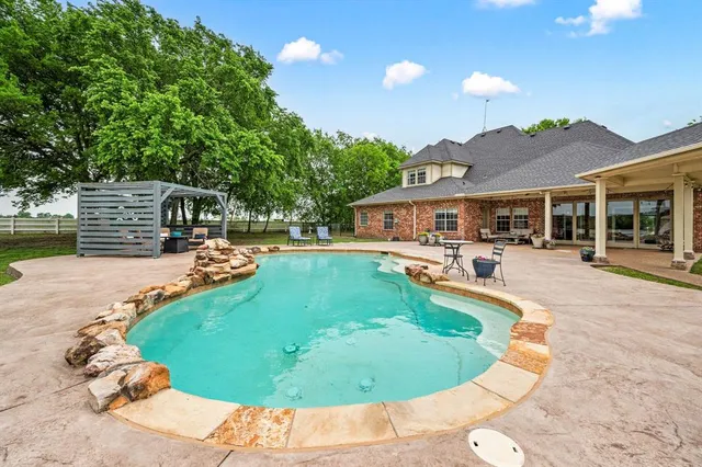 an aerial view of a house with a garden