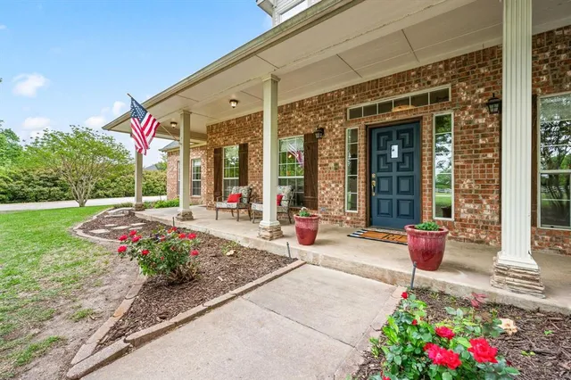 a front view of a house with a porch