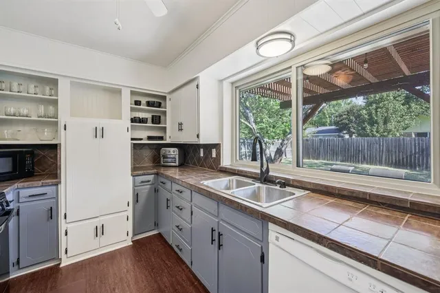 a kitchen with a sink and a stove