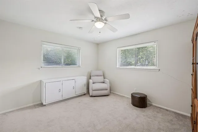 a view of an empty room with a cabinet