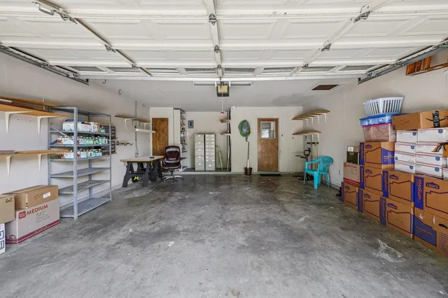 a patio with table and chairs