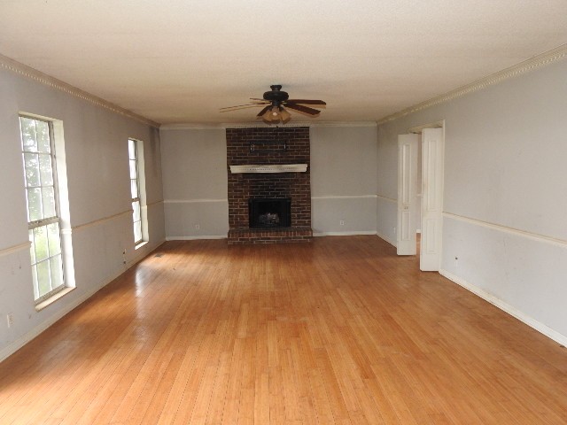 3405 Country Ridge Drive Antioch, TN 37013 - Photo 2 of 19 an empty room with wooden floor fireplace and windows