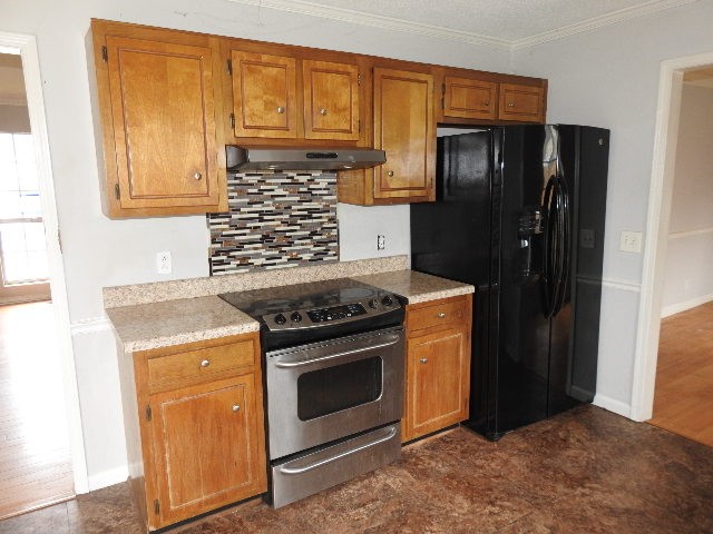 3405 Country Ridge Drive Antioch, TN 37013 - Photo 4 of 19 a kitchen with stainless steel appliances granite countertop a refrigerator stove and cabinets