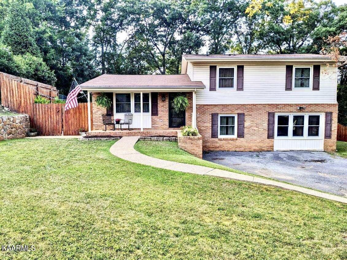 a front view of a house with a yard table and chairs