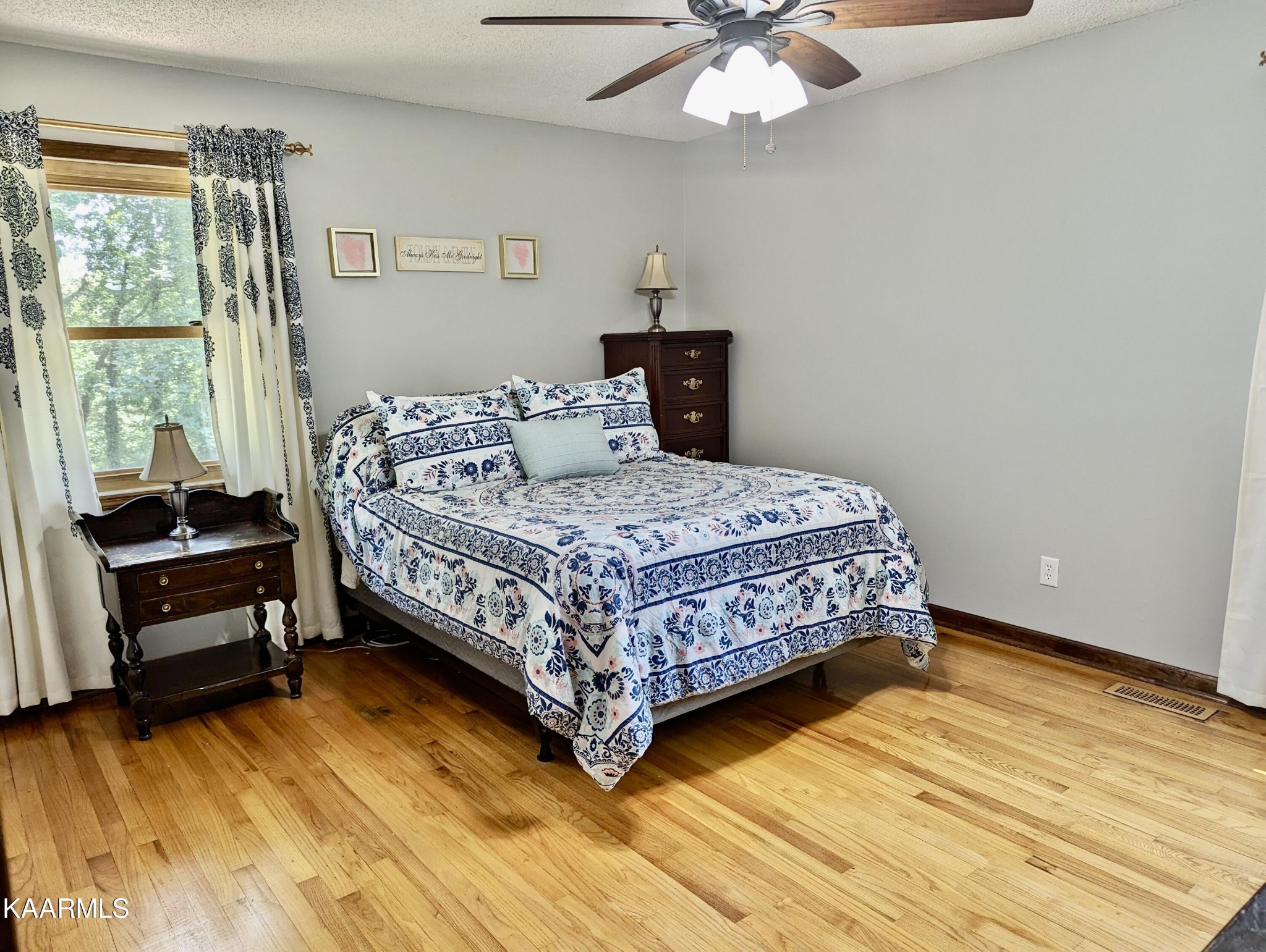 4518 Cloverdale Loop Hixson, TN 37343 - Photo 11 of 24 a bedroom with a bed and a chandelier