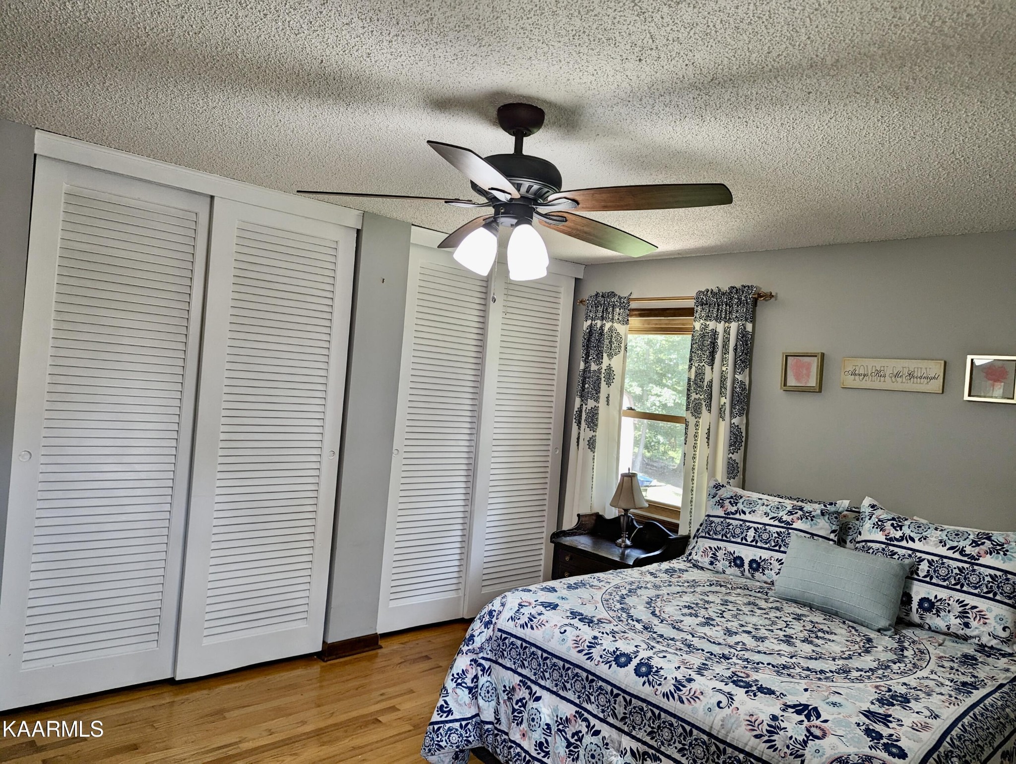 4518 Cloverdale Loop Hixson, TN 37343 - Photo 12 of 24 a bedroom with a bed and wooden floor