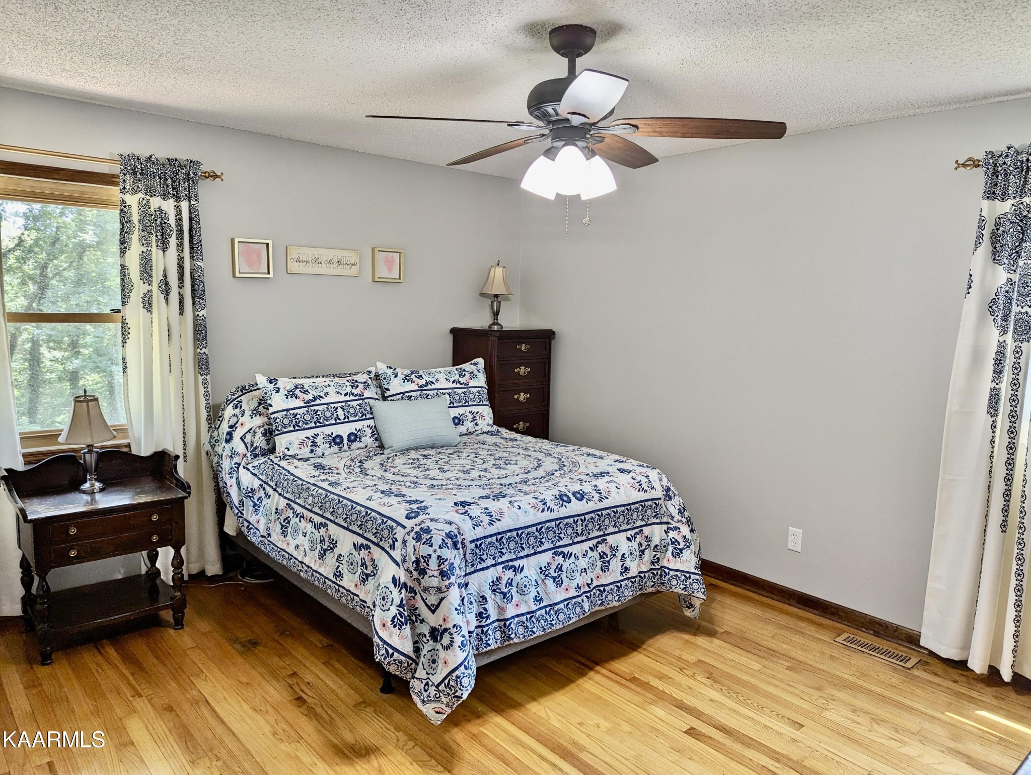 4518 Cloverdale Loop Hixson, TN 37343 - Photo 13 of 24 a bedroom with a bed chandelier and a window