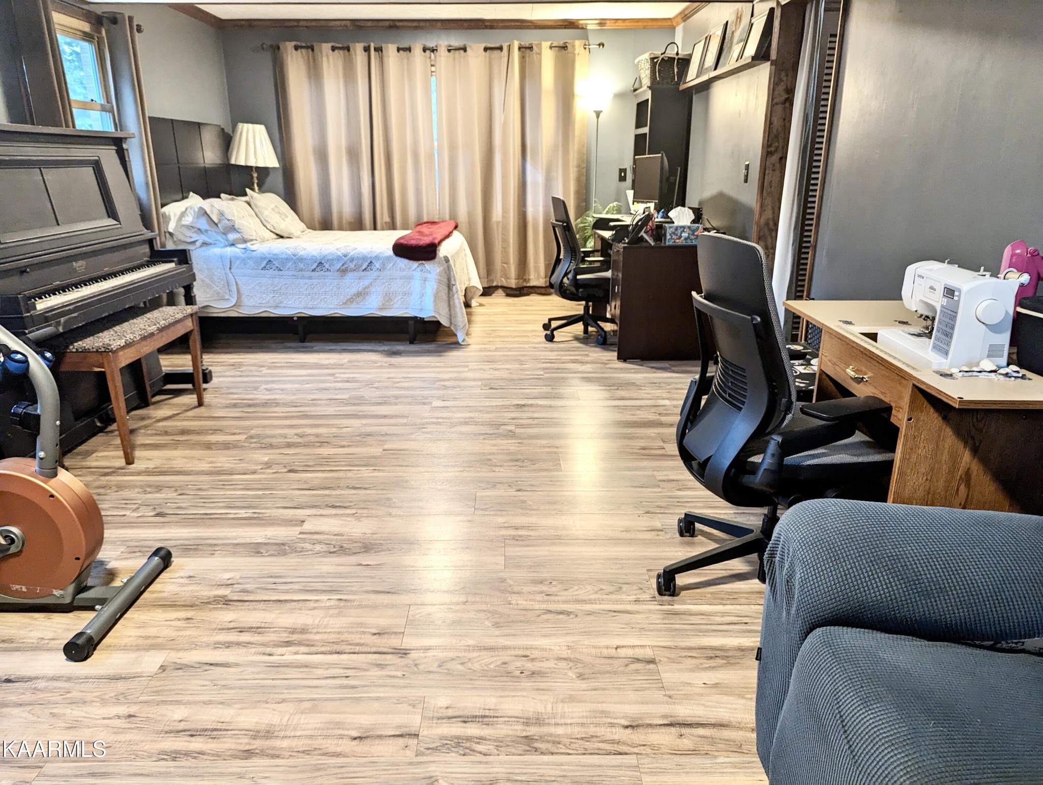 4518 Cloverdale Loop Hixson, TN 37343 - Photo 17 of 24 a bedroom with furniture and a wooden floor