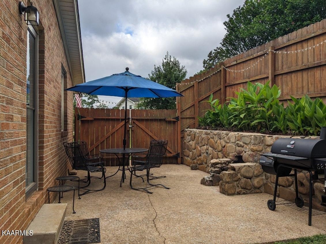 4518 Cloverdale Loop Hixson, TN 37343 - Photo 22 of 24 a backyard of a house with table and chairs