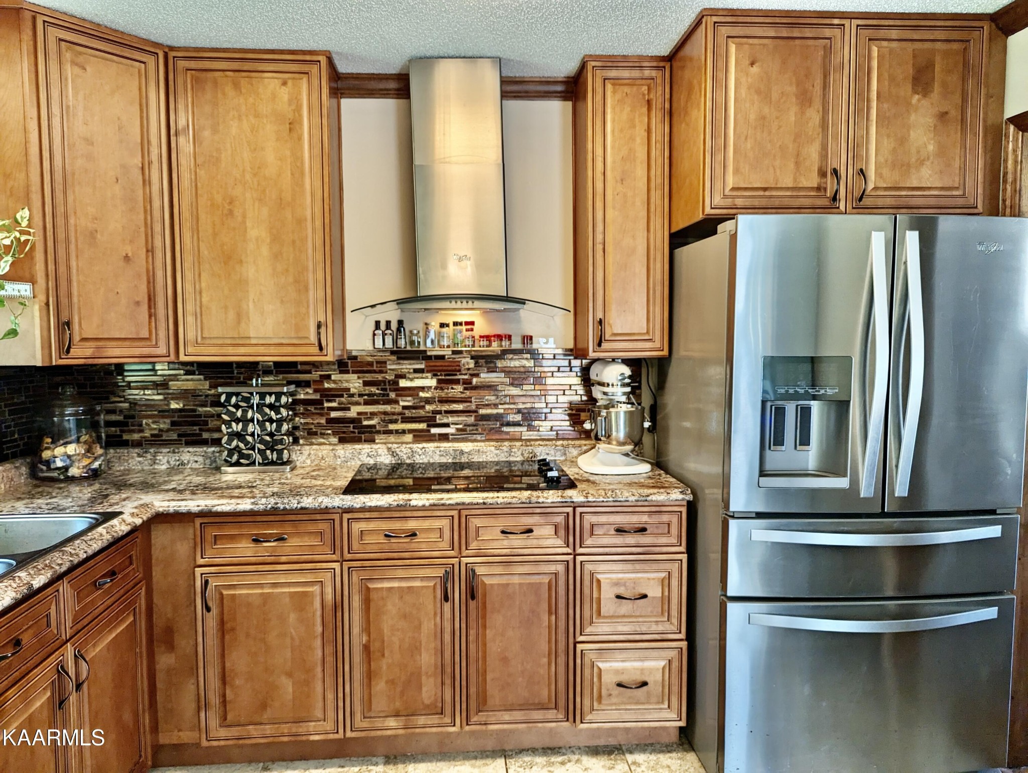 4518 Cloverdale Loop Hixson, TN 37343 - Photo 8 of 24 a kitchen with stainless steel appliances granite countertop a refrigerator and a stove