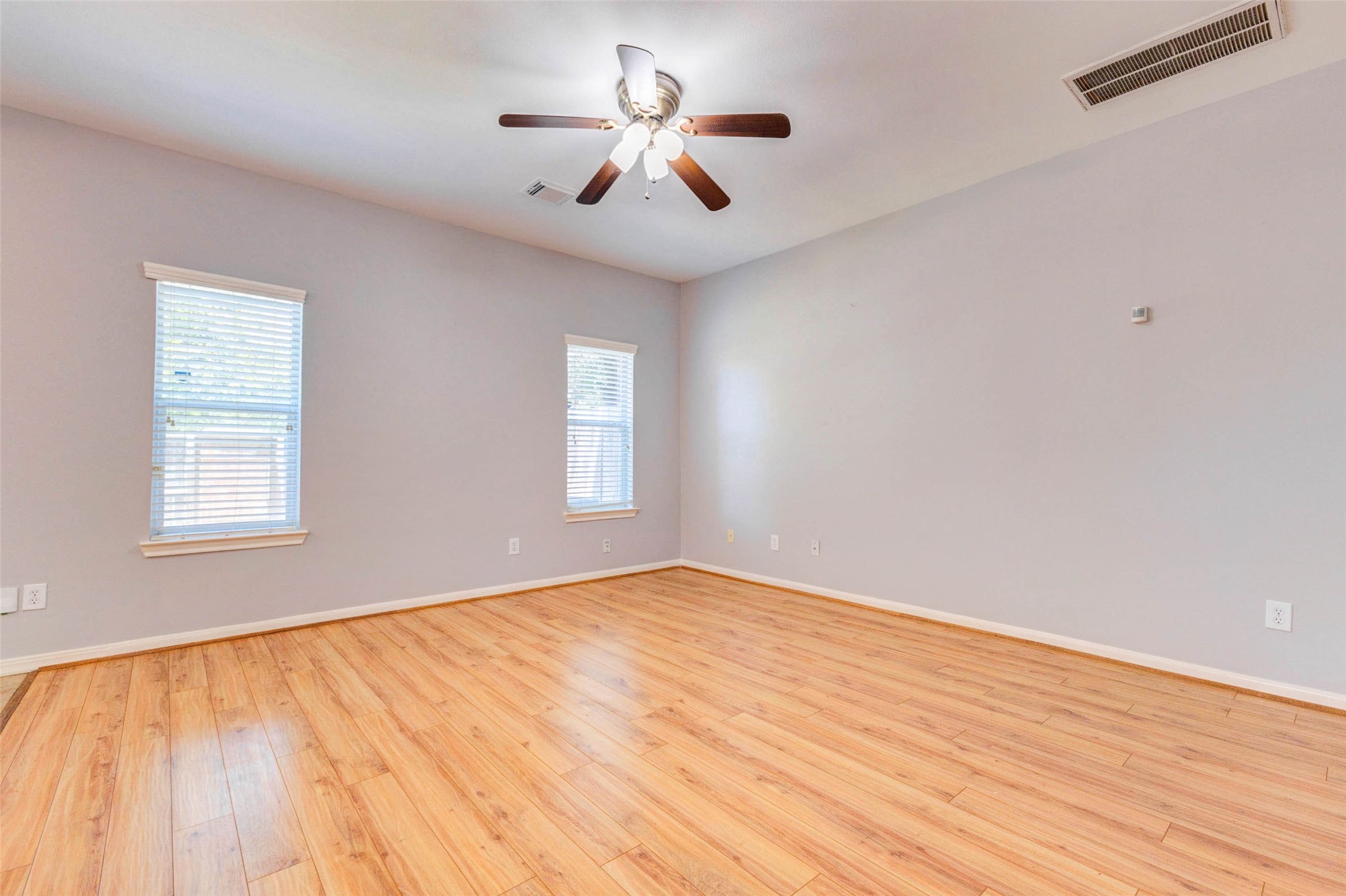 14522 Durham Chase Lane Houston, TX 77095 - Photo 7 of 40 a view of empty room with wooden floor and fan