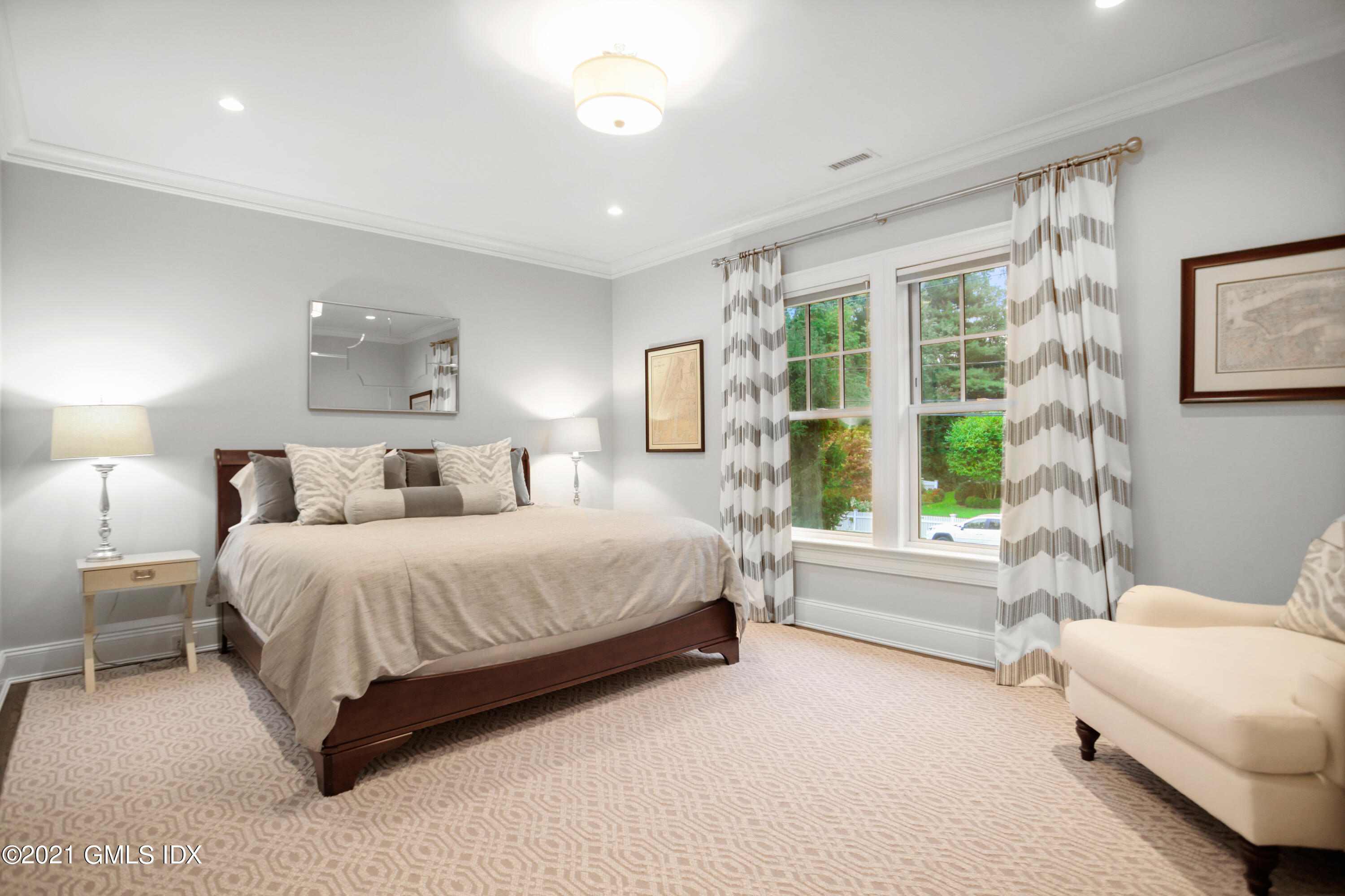 48 Winthrop Drive Riverside, CT 06878 - Photo 22 of 40 a spacious bedroom with a bed and a large window