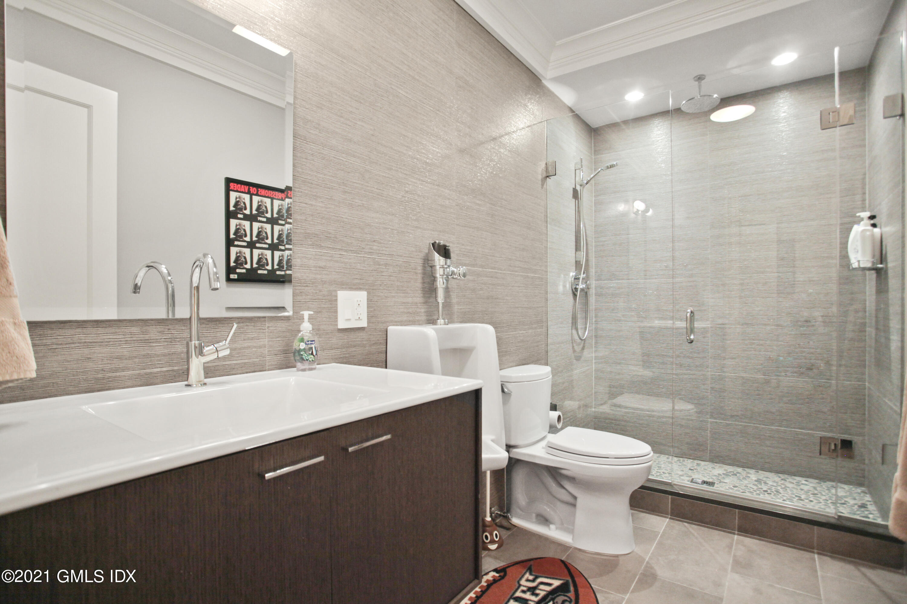 48 Winthrop Drive Riverside, CT 06878 - Photo 34 of 40 a bathroom with a sink a toilet and shower