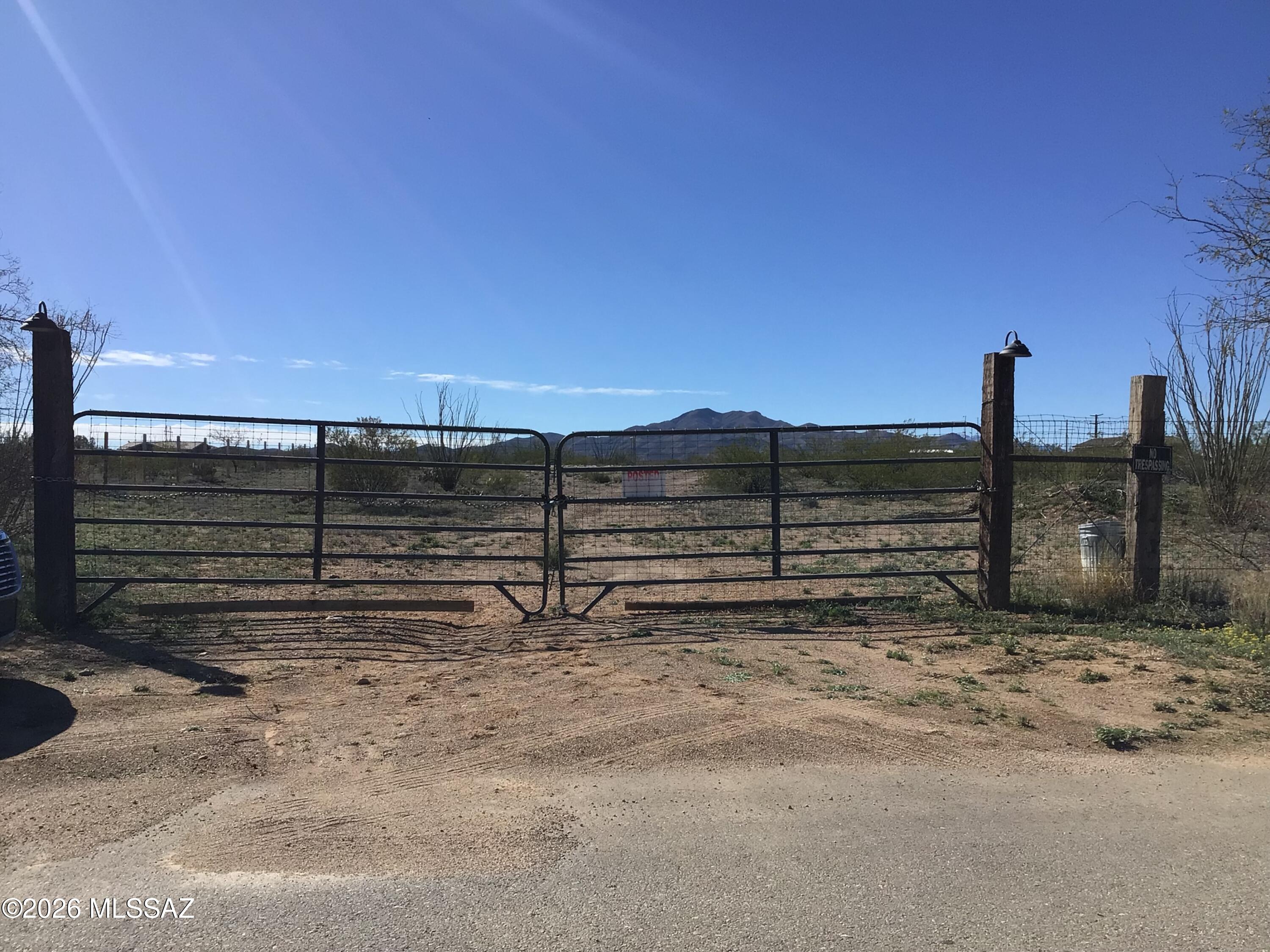 3250 East Rincon View Drive, Unit 45 Vail, AZ 85641 - Photo 6 of 6 a view of a parking space with wooden fence