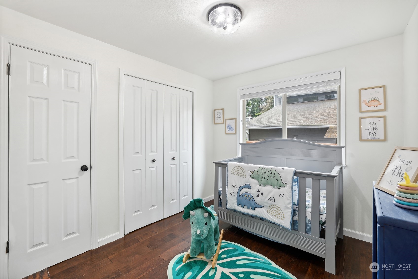 14119 150th Place Southeast Renton, WA 98059 - Photo 17 of 29 a bedroom with furniture and a wooden floor