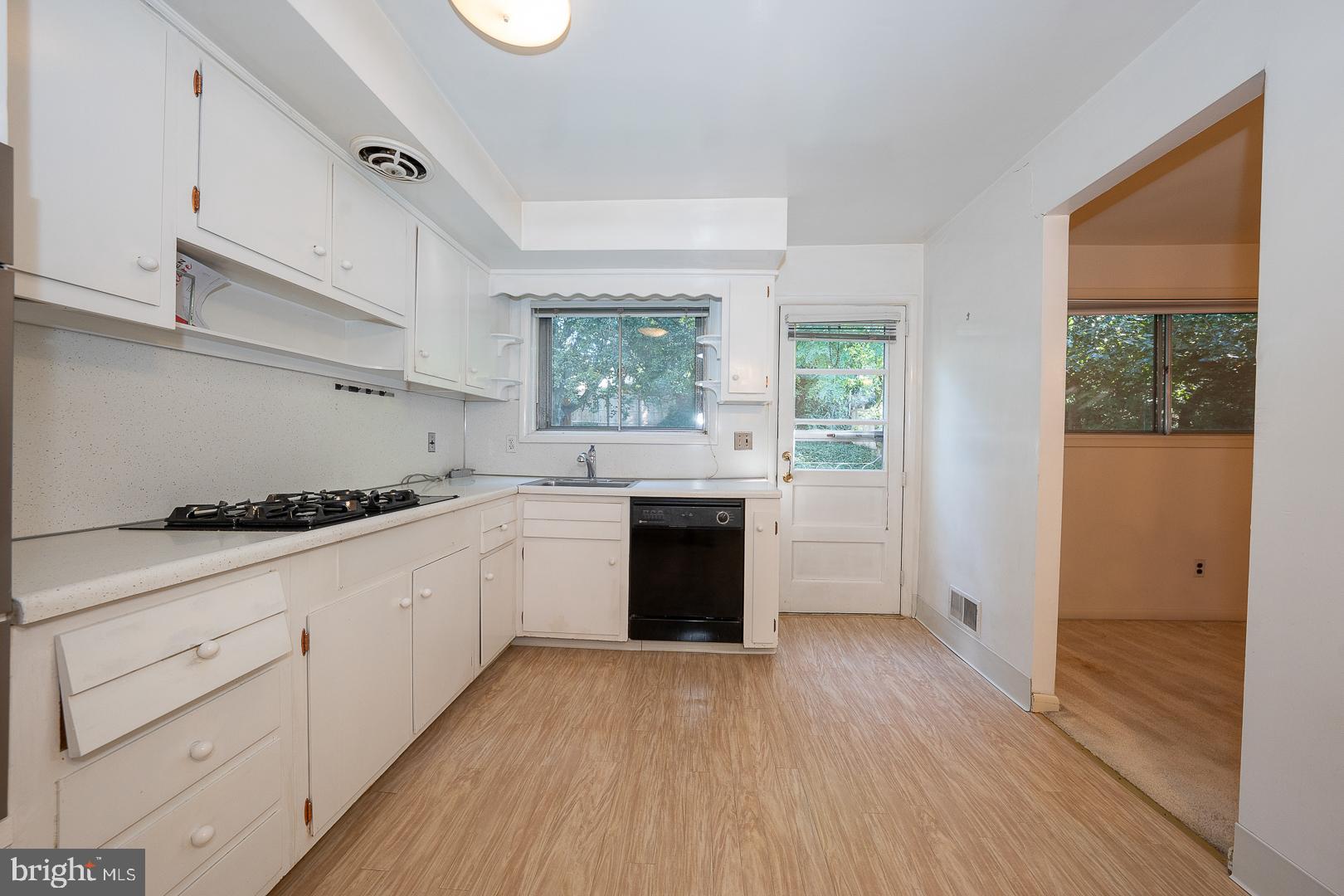 621 Conshohocken State Road Bala Cynwyd, PA 19004 - Photo 11 of 30 a kitchen with granite countertop white cabinets and white appliances