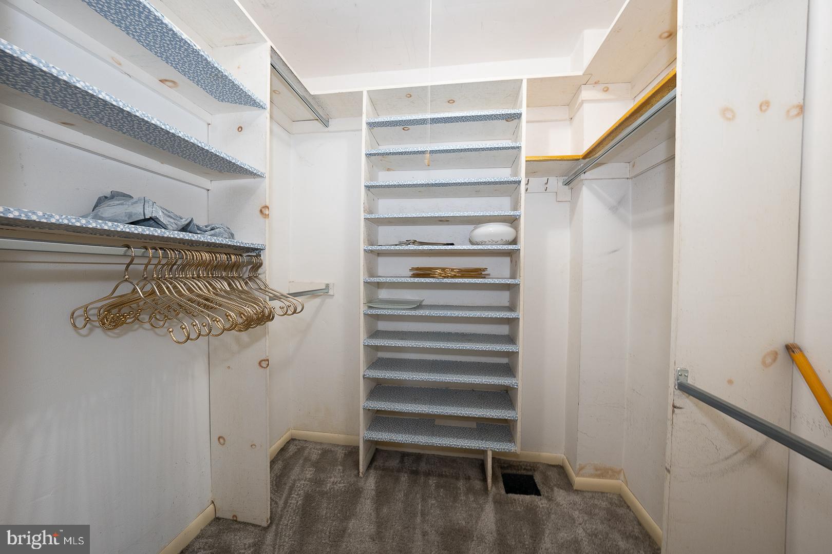 621 Conshohocken State Road Bala Cynwyd, PA 19004 - Photo 15 of 30 a view of walk in closet with empty racks