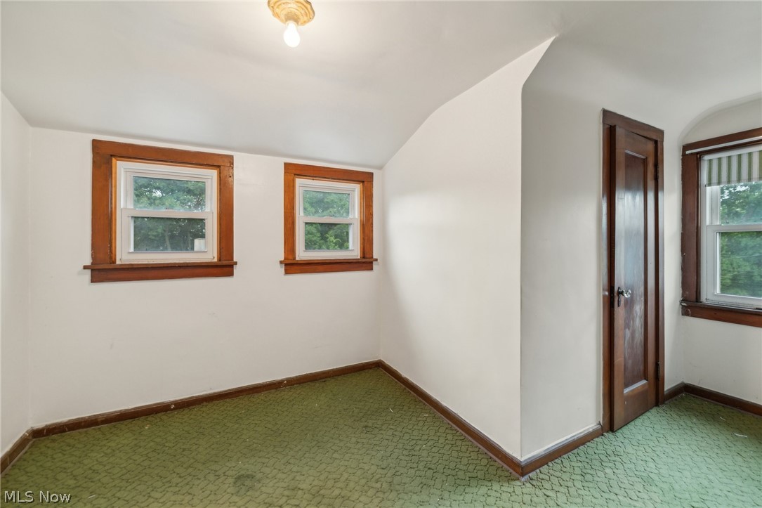 3619 Strathavon Road Cleveland, OH 44120 - Photo 34 of 49 Additional living space featuring vaulted ceiling and carpet