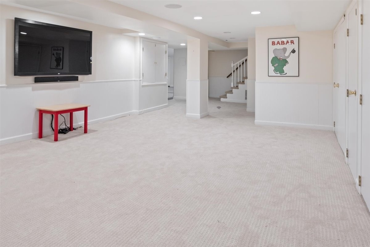 114 Dewindt Road Winnetka, IL 60093 - Photo 54 of 62 a living room with furniture and a flat screen tv