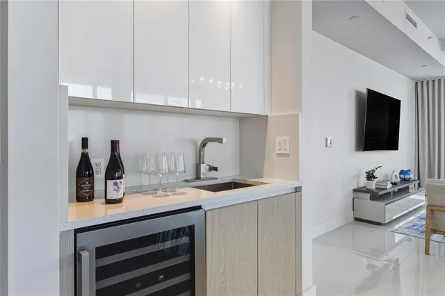 a kitchen with sink and cabinets