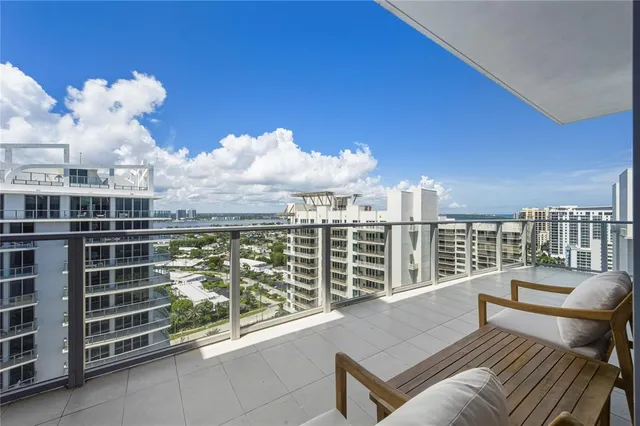 a bathroom with a shower and a sink