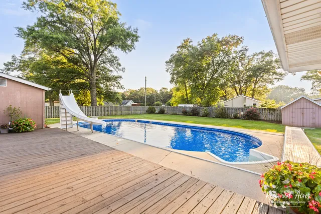 a view of a swimming pool with a lounge chair