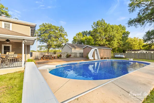 a view of a swimming pool with a patio