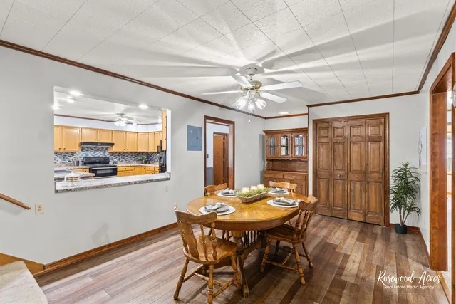 a view of a dining room with furniture window and wooden floor