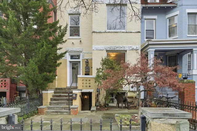 a front view of a building with large windows