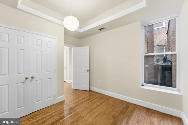 a bathroom with a sink toilet tub vanity and shower