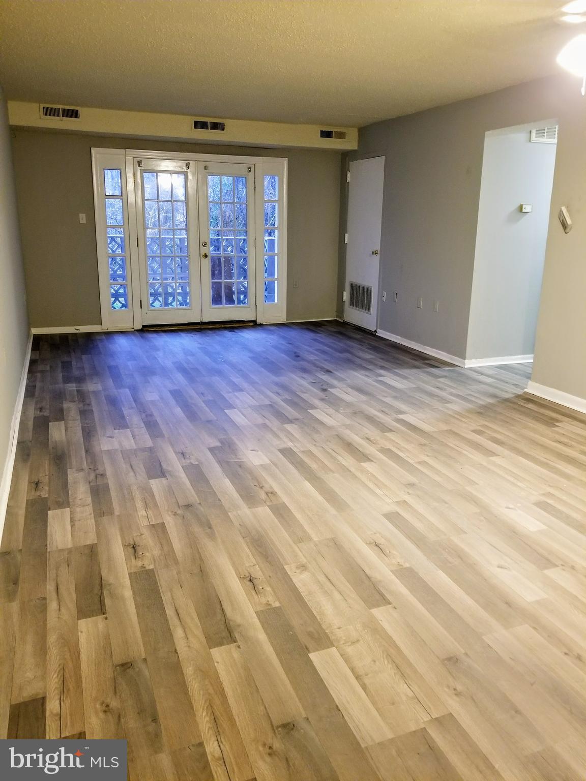 3807 Swann Road, Unit T1 Suitland, MD 20746 - Photo 2 of 8 a view of an empty room with a window