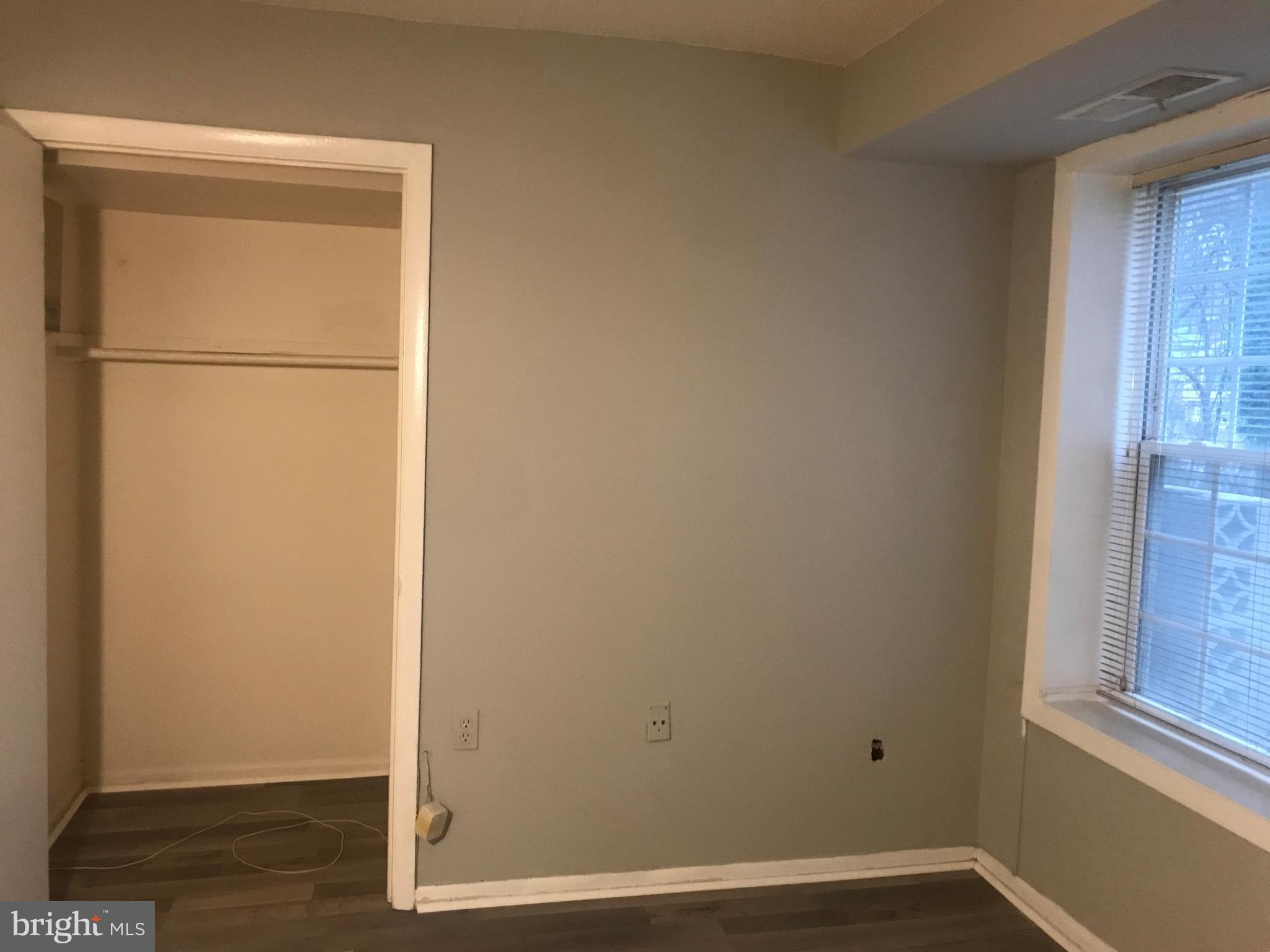 3807 Swann Road, Unit T1 Suitland, MD 20746 - Photo 4 of 8 a view of small space with wooden floor