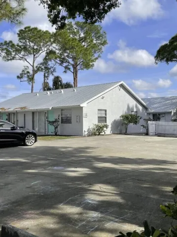 a view of a house and a yard