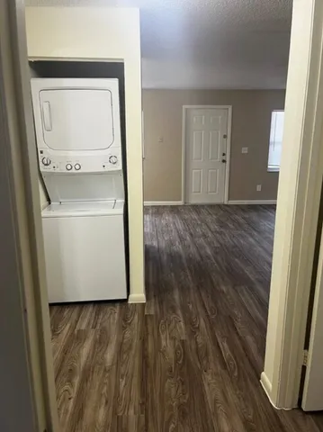 a room with wooden floor and a sink