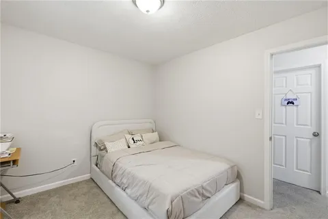 a bedroom with a bed and utility room