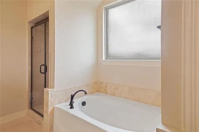 a bathroom with bathtub