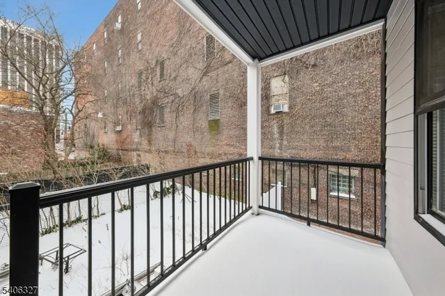 a view of balcony with wooden fence