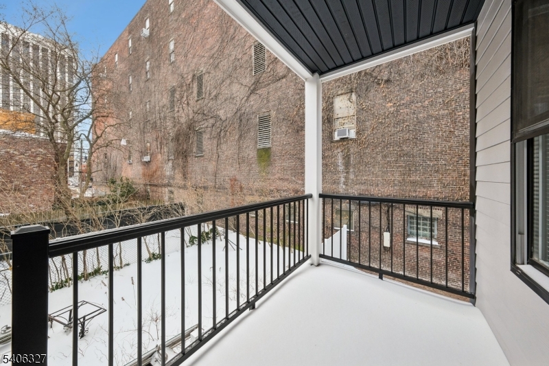 52 James Street, Unit 2 Newark, NJ 07102 - Photo 19 of 27 a view of balcony with wooden fence