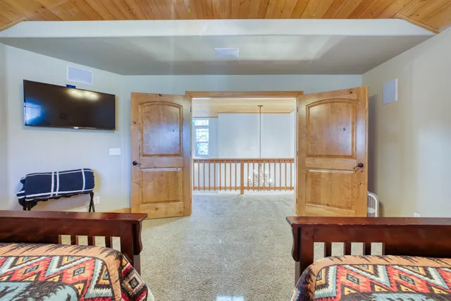 a living room with furniture and a clock