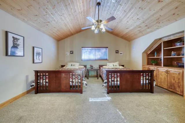 a view of a bedroom with furniture and staircase