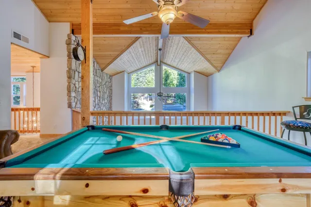 a view of a house with a yard and sitting area