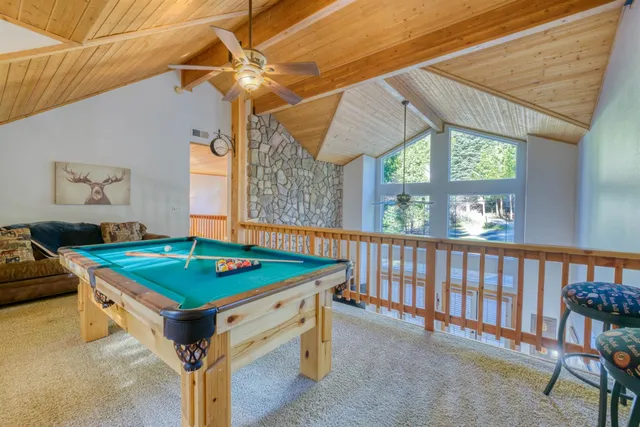 a view of a yard with large trees